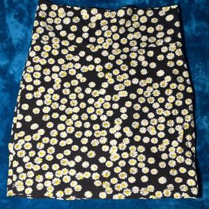 black skirt with daisies
